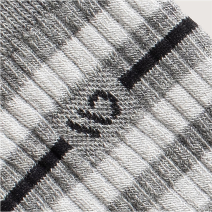 detail image of 9002 Light gray, featuring a black logo and stripe, with wider white and gray stripes