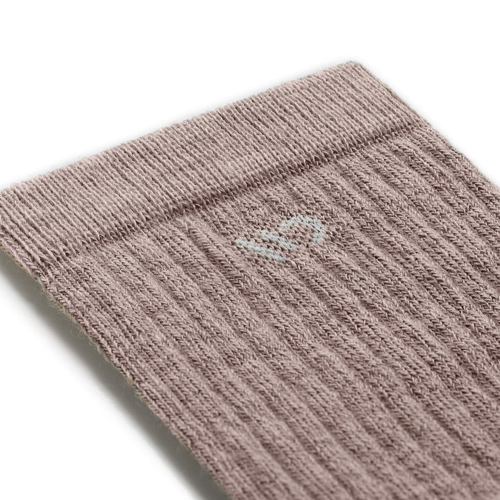 close up detail image of 9001 in rye colorway with cream color logo