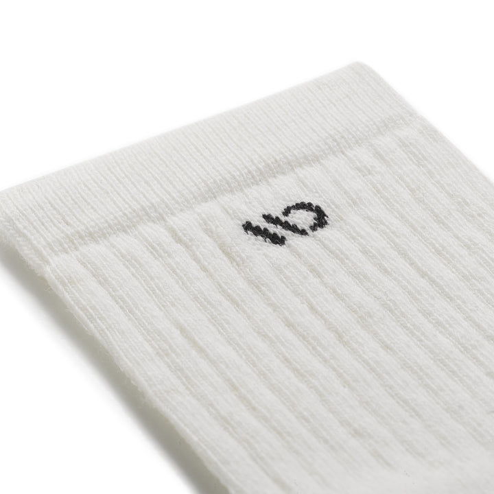 close up detail image of 9001 in white colorway with black logo
