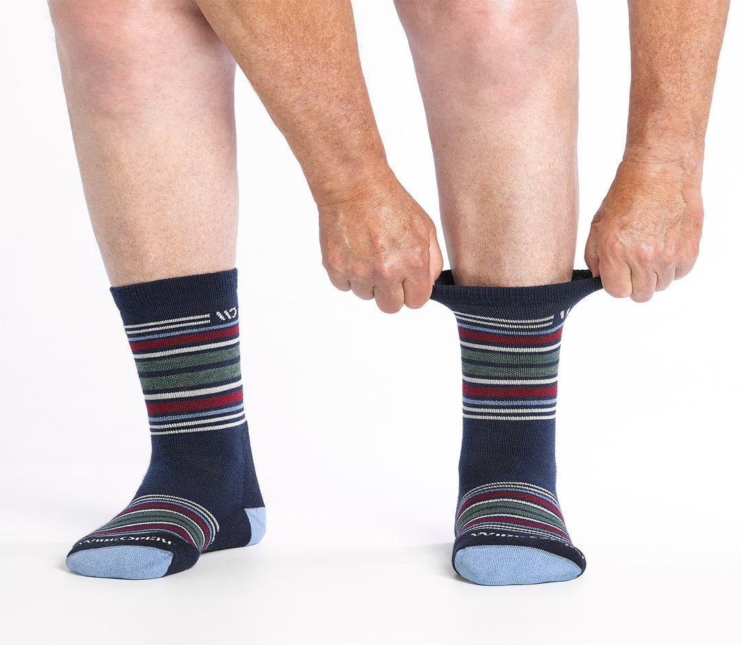 on model image of model stretching the top cuff of the 9005 multi stripe micro crew in eclipse