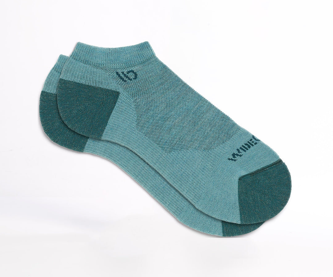 Flat socks featuring teal heel/toe and logo, with light teal body --Light Teal