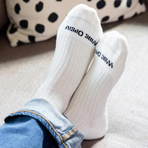 Shop Solid Socks - feet wearing solid white socks with extra stretch