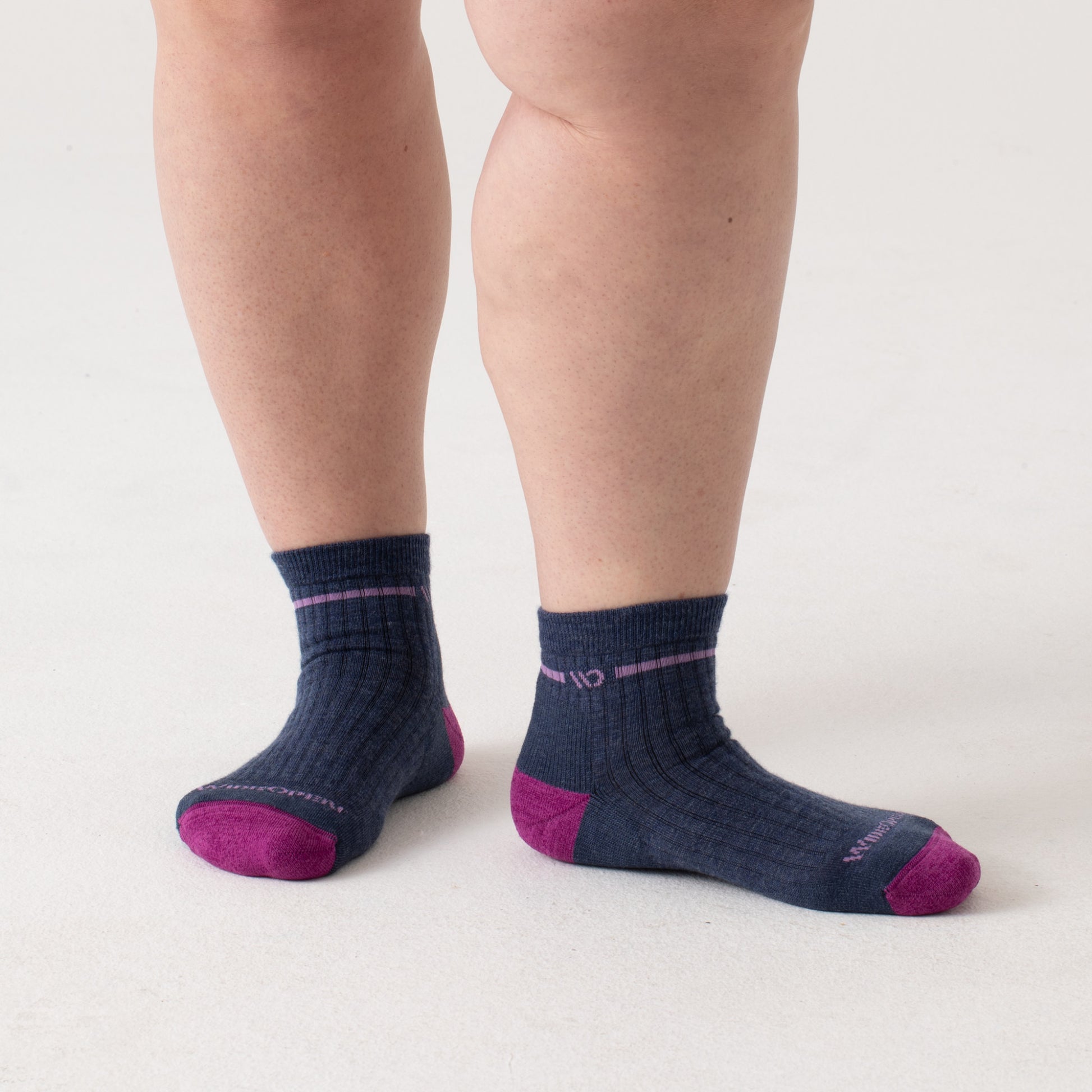 On model quarters, fuchsia toe, lavender logo and stripe under cuff, denim body--Denim