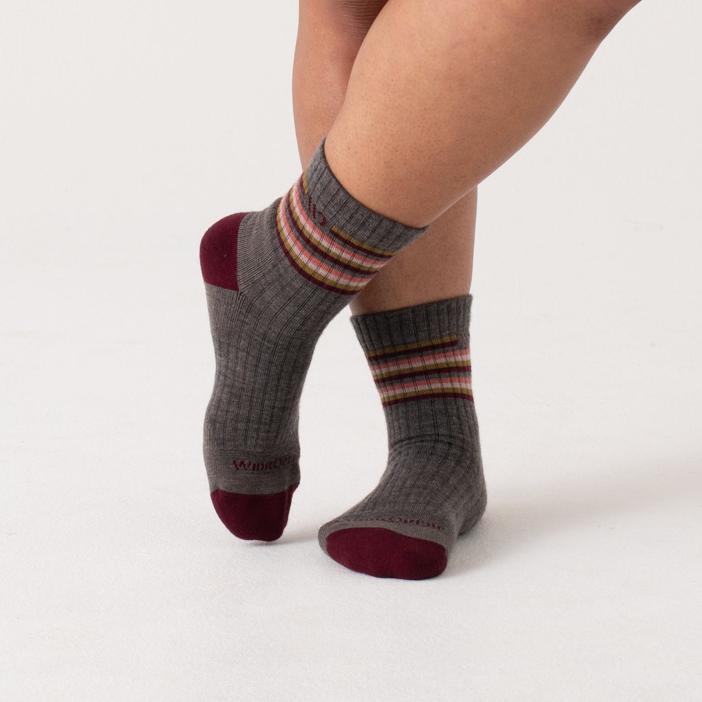 On model Micro Crews: maroon heel/toe, taupe body with Stripes below the cuff --Taupe