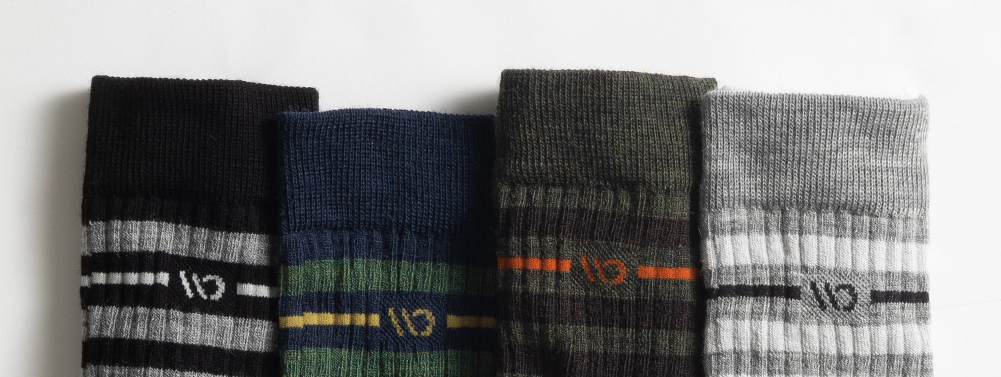 The top of four different colors socks of the Men's Vintage Stripe Cushioned Crew Socks.