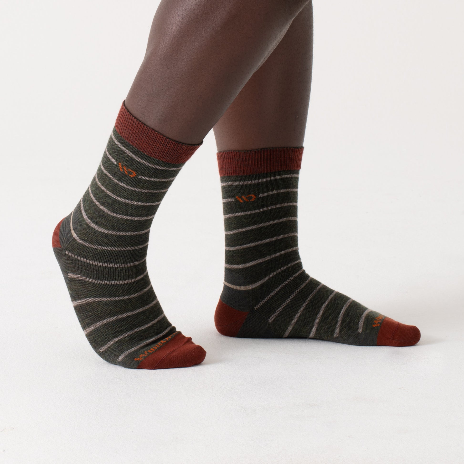 Profile of Crew socks with maroon toe, orange logo, forest body and gray stripes--Forest