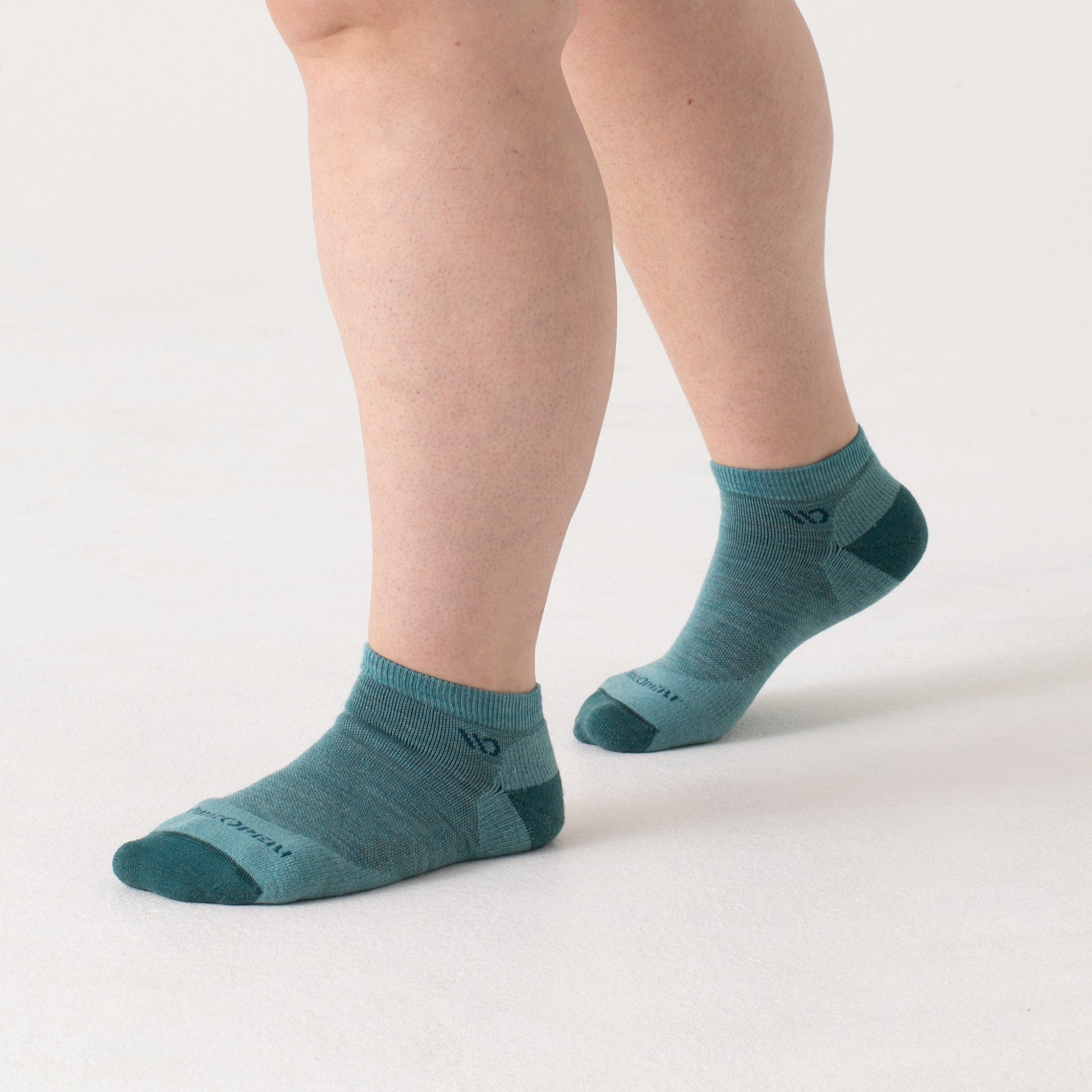On model: No shows with dark teal heel/toe and logo, with light teal body --Light Teal/Denim/Taupe