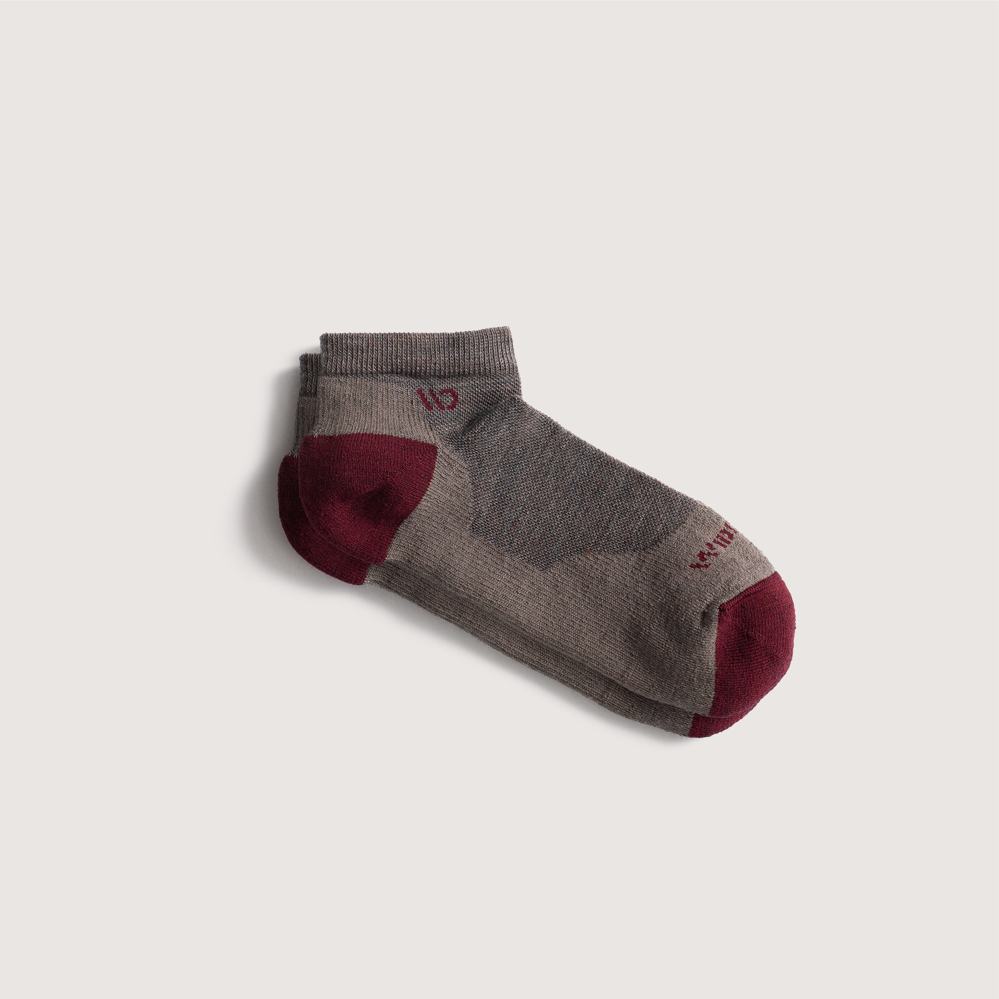 Flat socks featuring maroon heel/toe and logo, with taupe body--Taupe