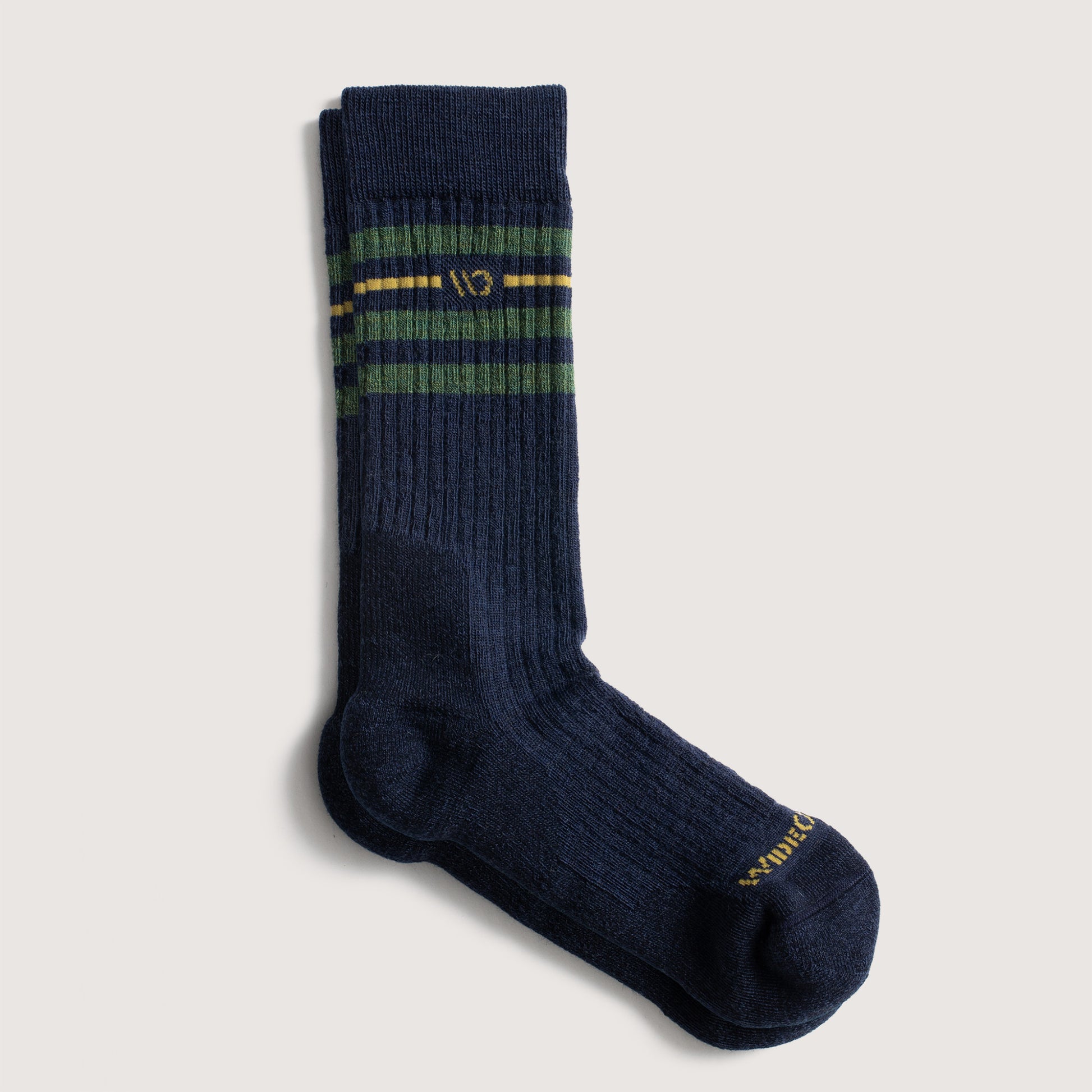 Flat socks featuring yellow logo, denim body, and green stripes below the cuff --Denim