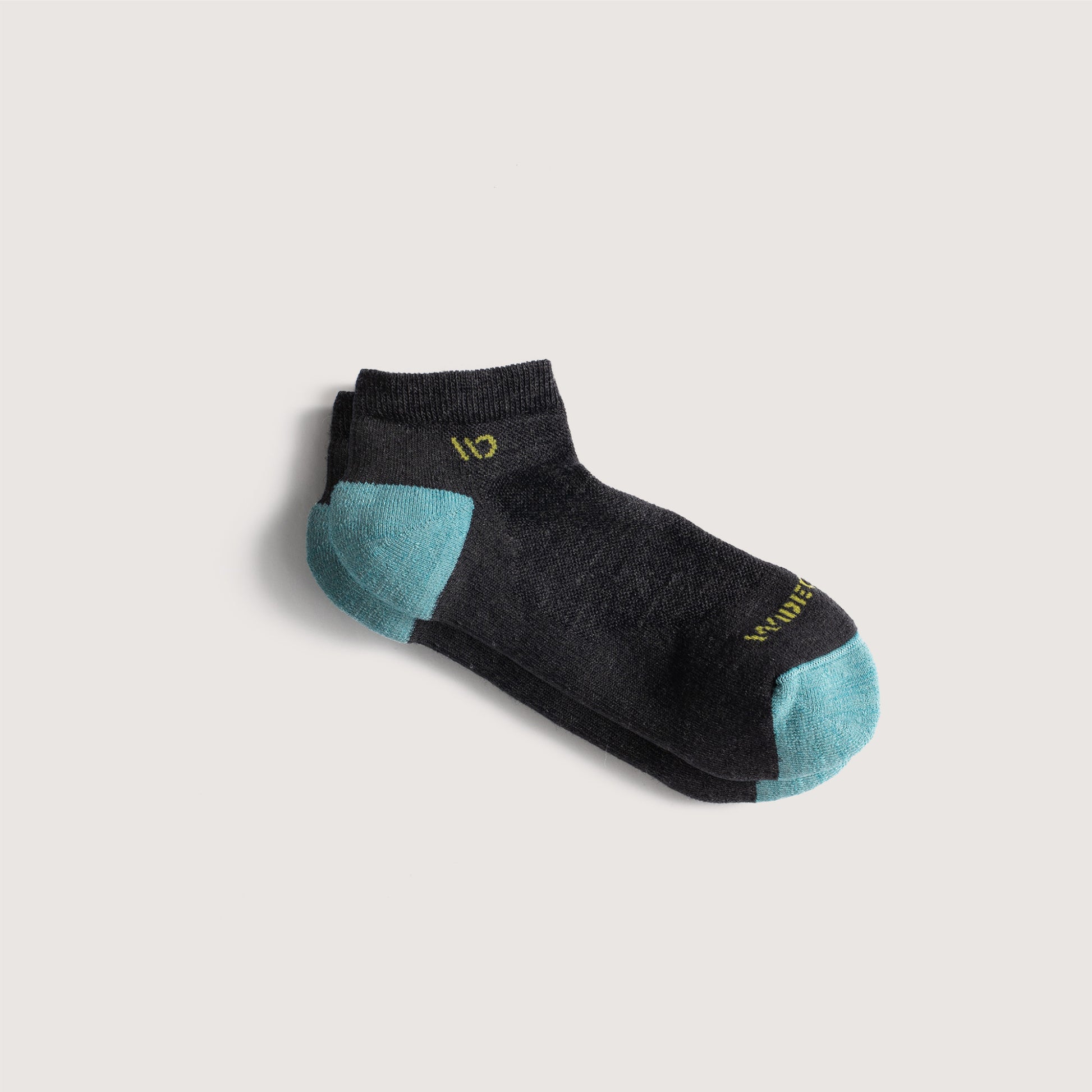 Flat socks featuring aqua heel/toe, yellow logo, and charcoal body --Charcoal
