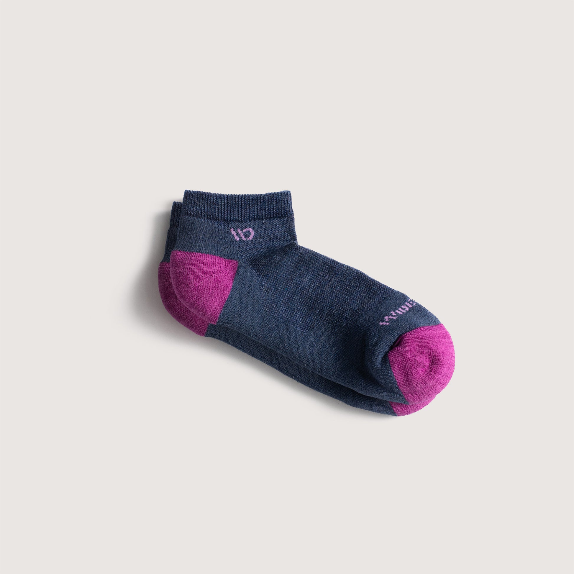 Flat socks featuring fuschia heel/toe, lavender logo, and denim body --Denim