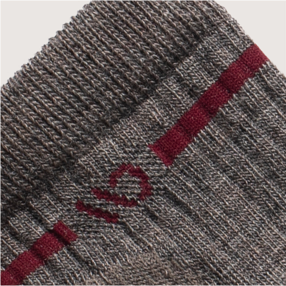 Detail featuring a maroon logo and a maroon stripe around the cuff--Taupe