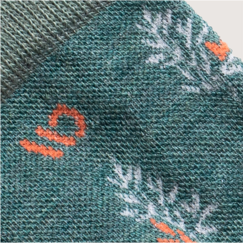 Detail featuring the logo in orange and the design in white--Teal