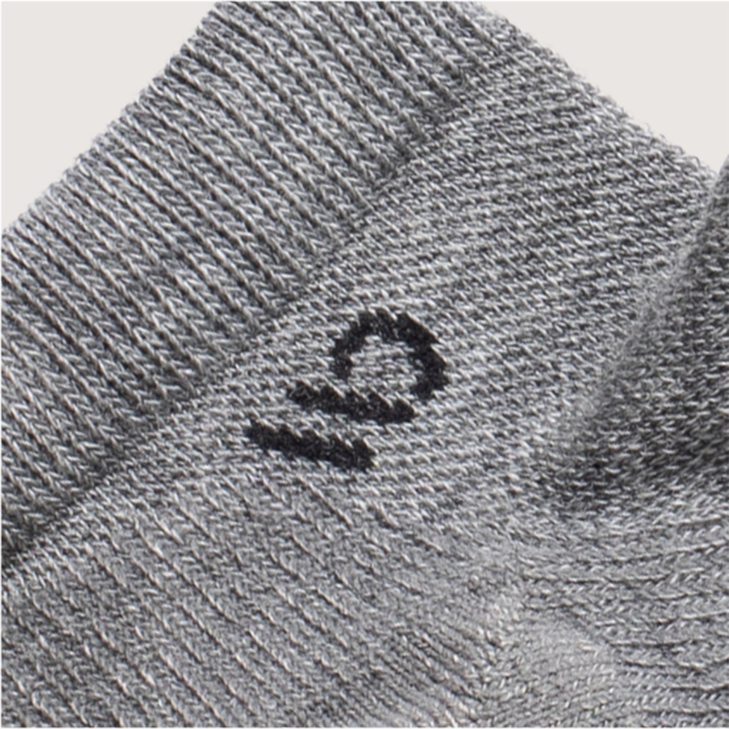 Detail of Light gray, featuring a black logo and light gray body --Light Gray