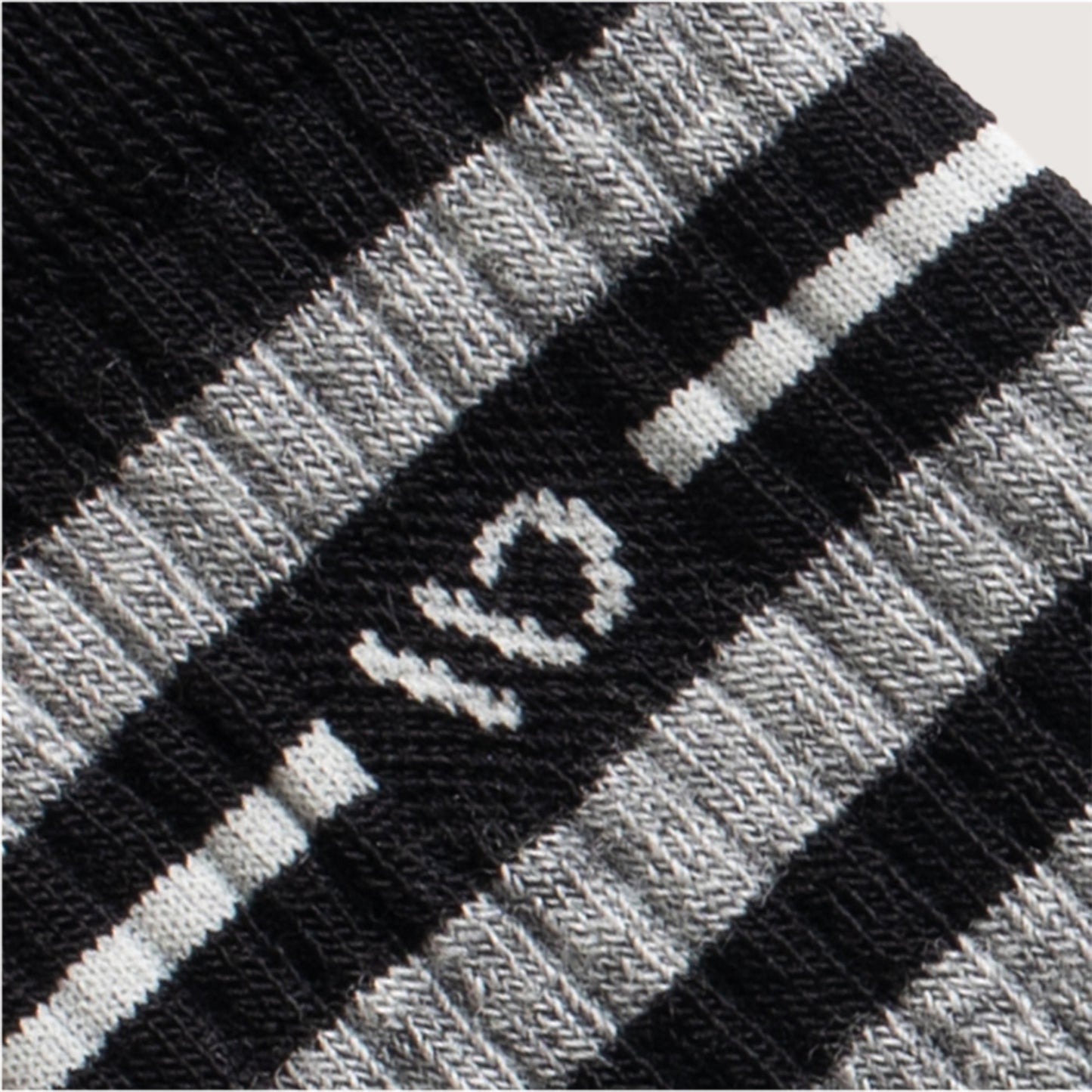 Detail featuring a white logo and stripe, with wider gray and black stripes --Black