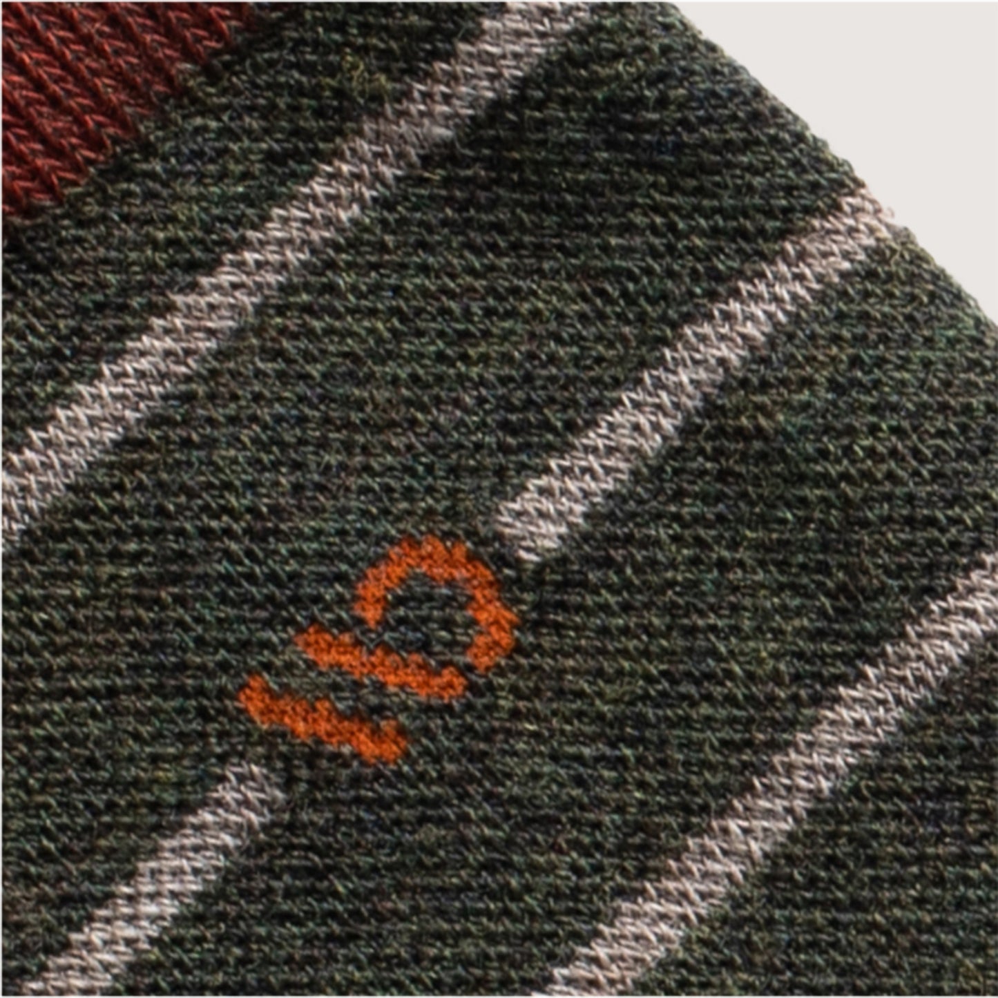 Detail featuring an orange logo with wide spaced white stripe and forest body --Forest