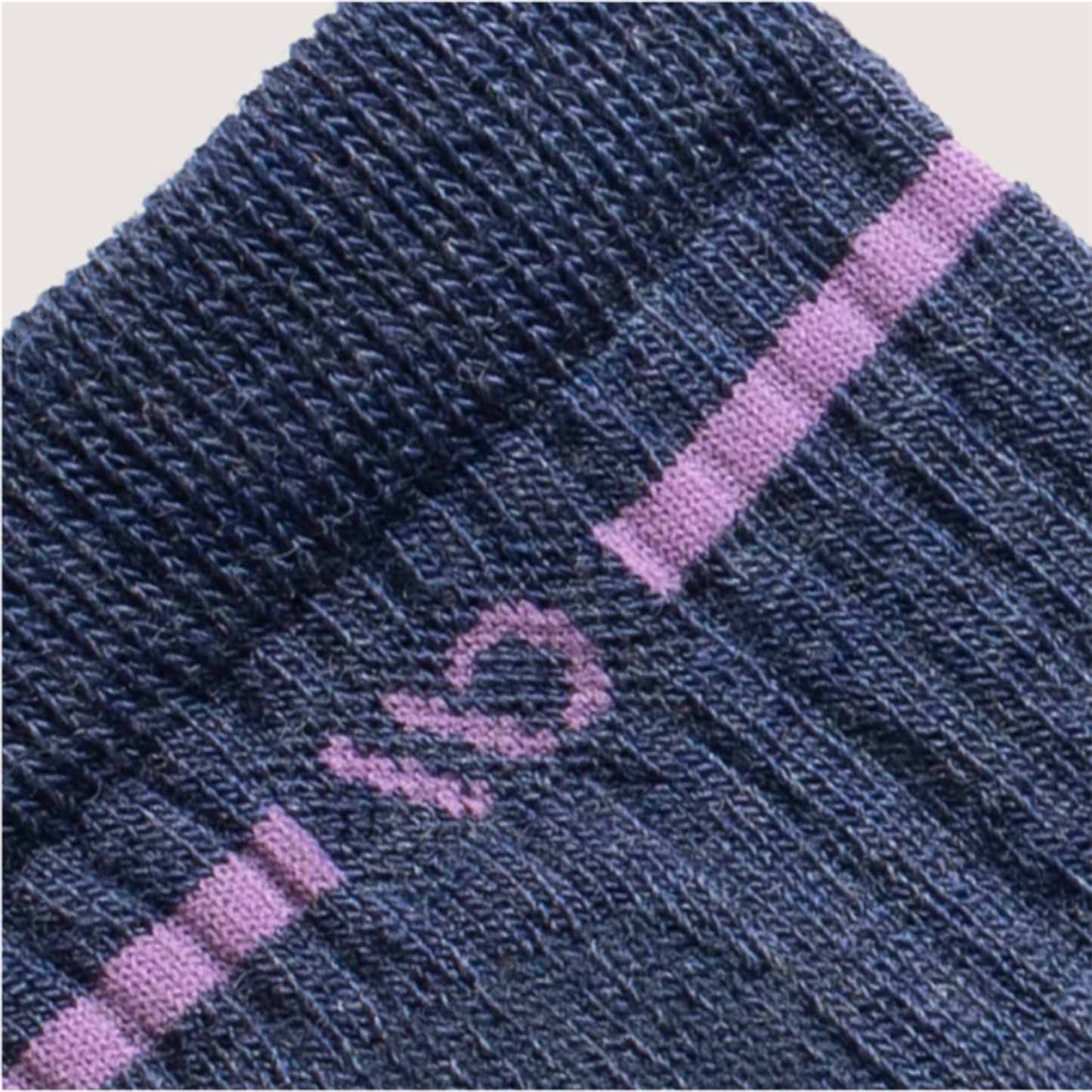 Detail featuring a Lavender logo and stripe around the cuff--Denim