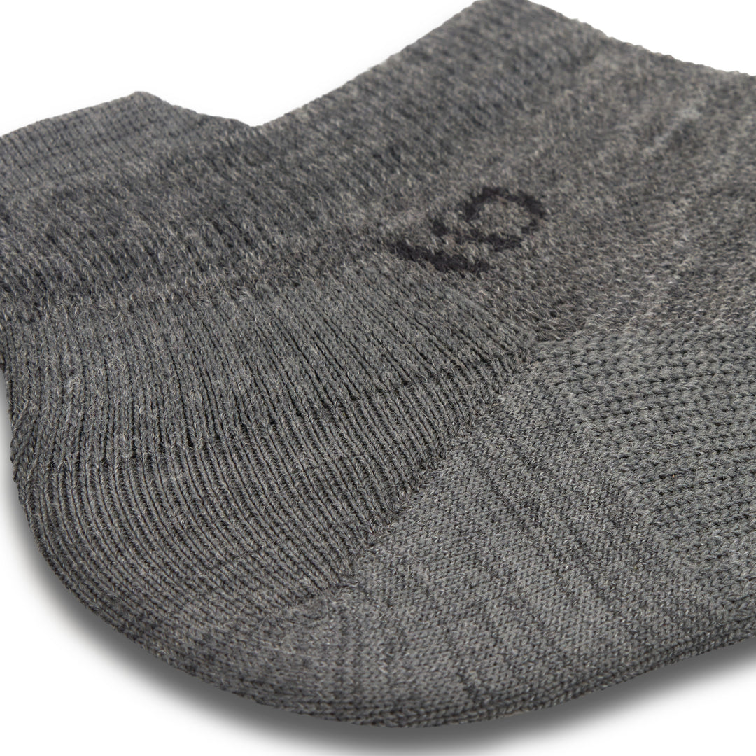 Close up detail image of the ankle on the 9013 solid lightweight ankle sock in gray