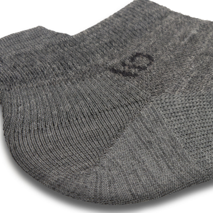 Close up detail image of the ankle on the 9013 solid lightweight ankle sock in gray