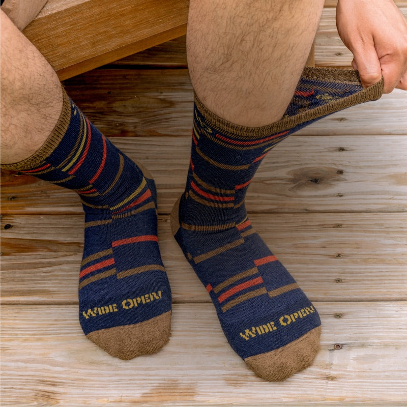 Feet wearing wide-fitting socks with an intermittent stripe pattern
