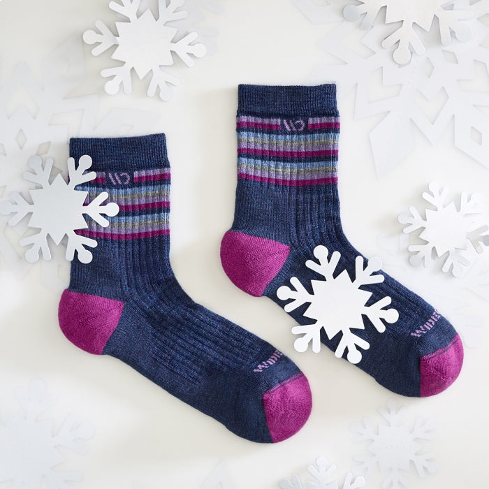 warm blue socks surrounded by snowflakes