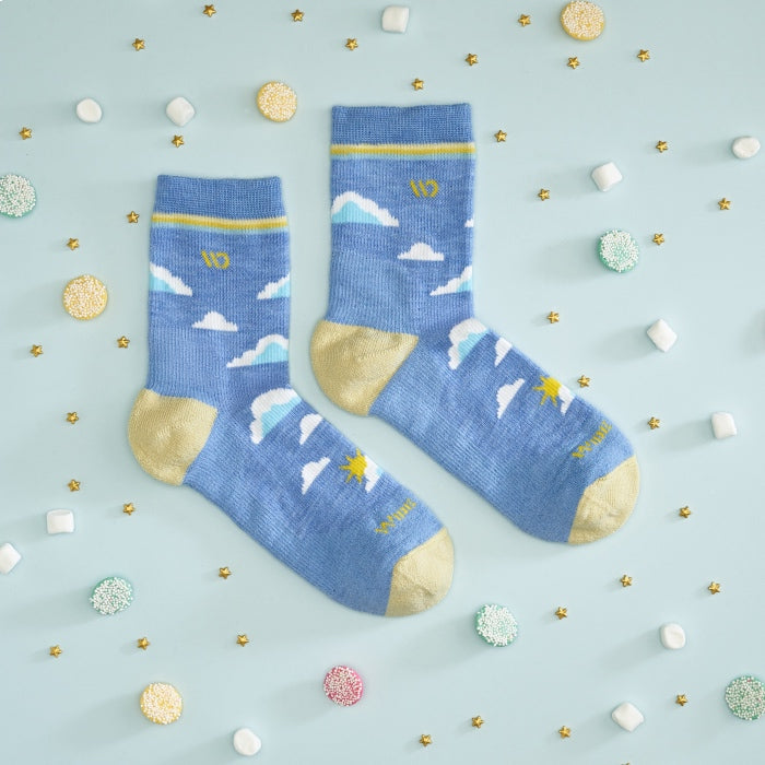 Blue socks with clouds on them, surrounded by gold stars and marshmallows 