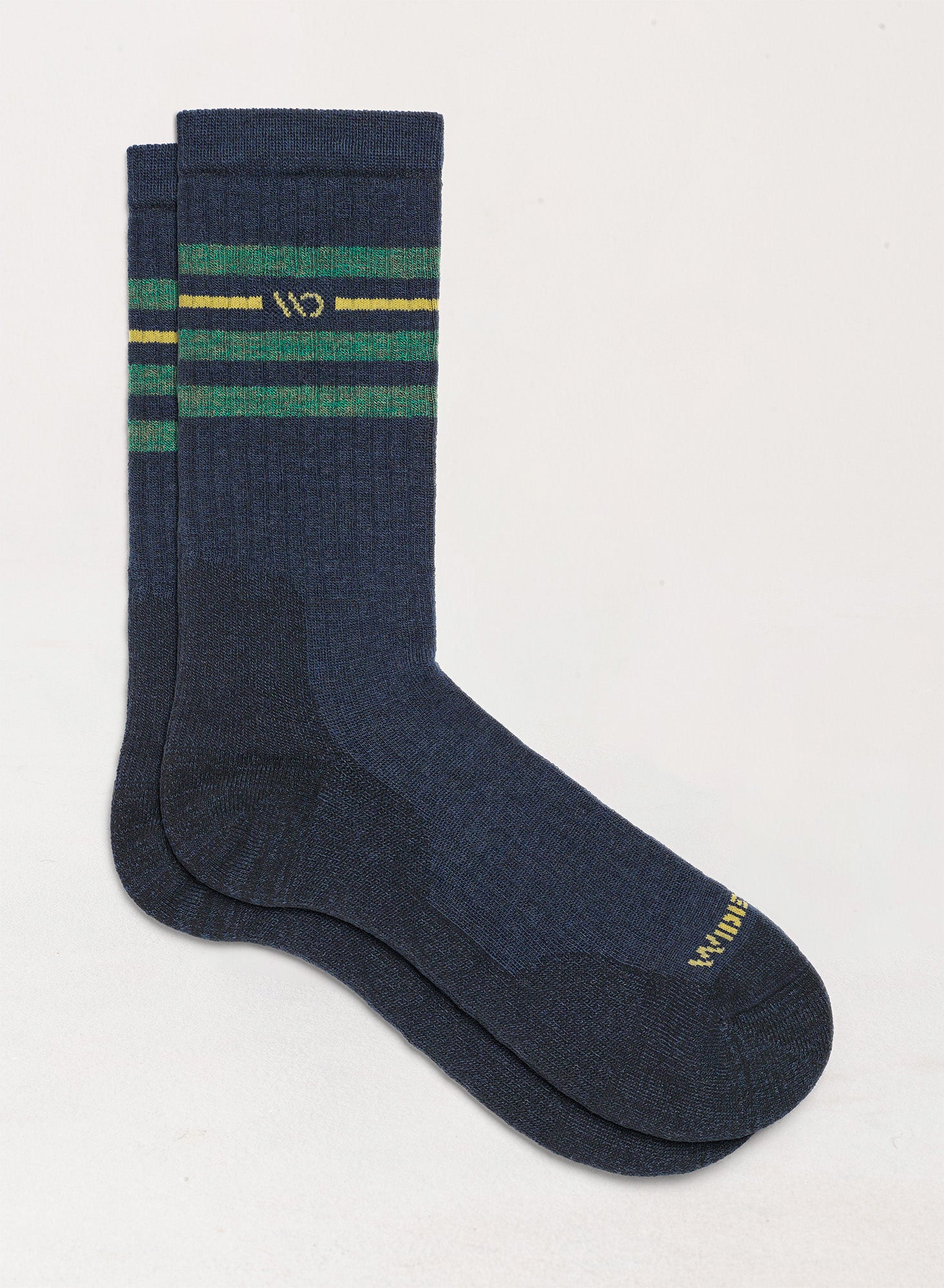 Flat socks featuring yellow logo, denim body, and green stripes below the cuff --Denim