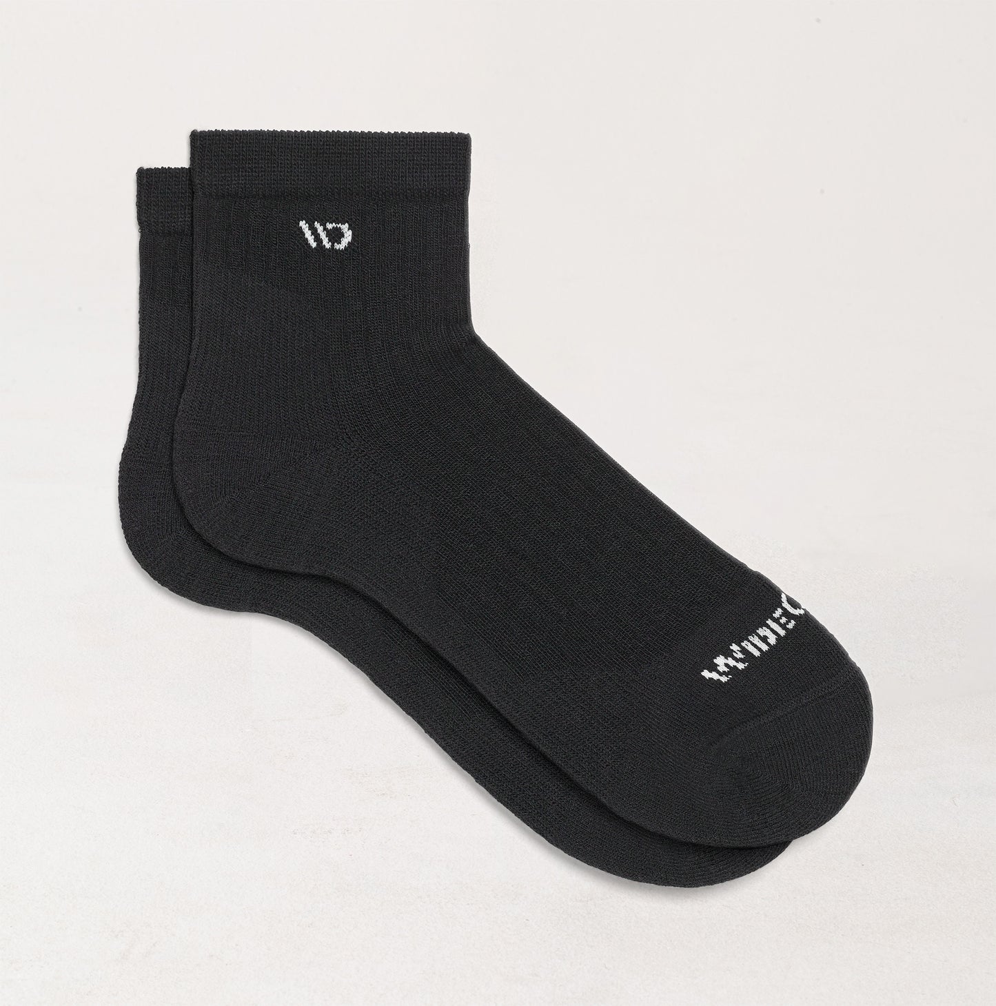 Socks laying flat with  black body and white logo--Black