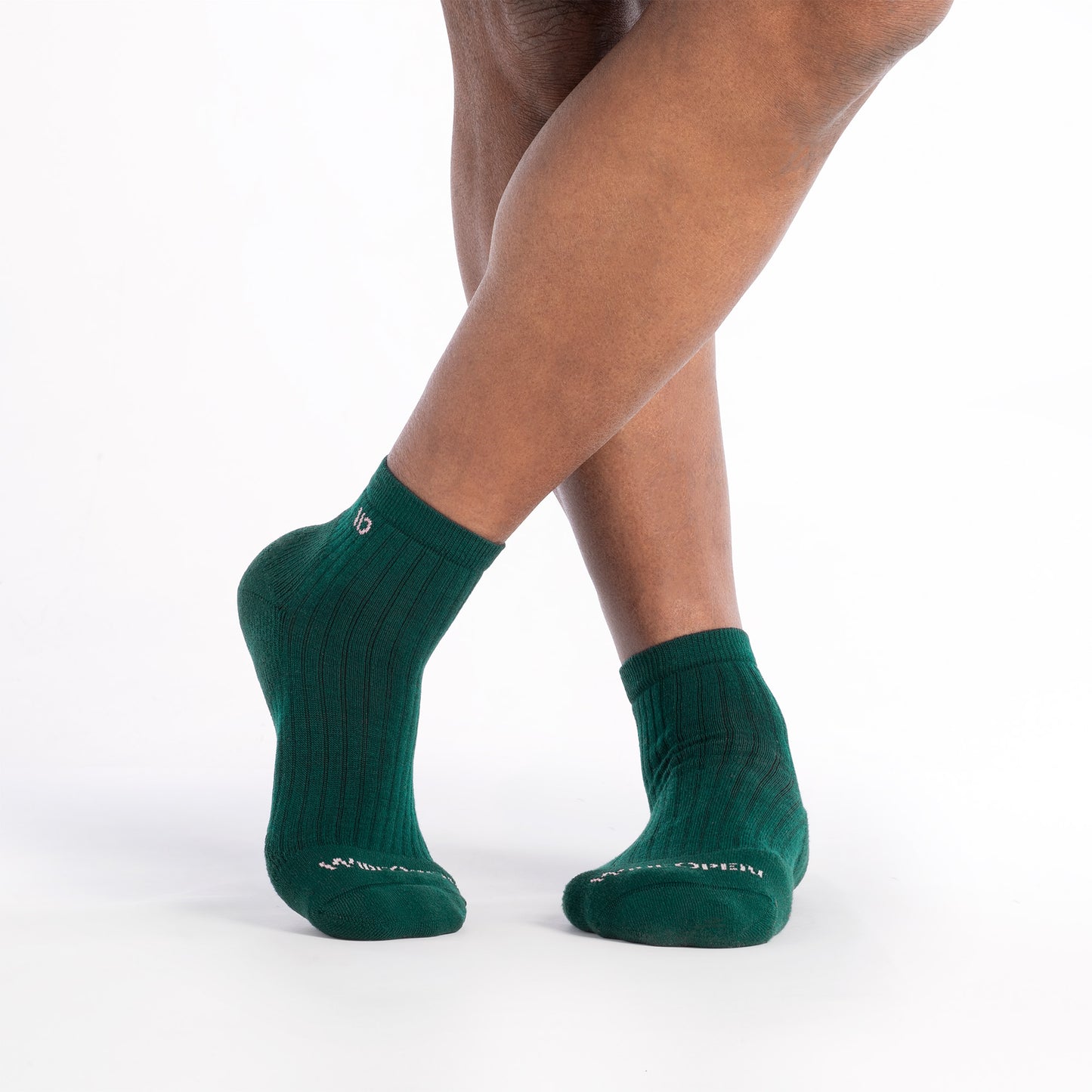 on model image of feet crossed wearing the 9004 solid Quarter sock in spruce