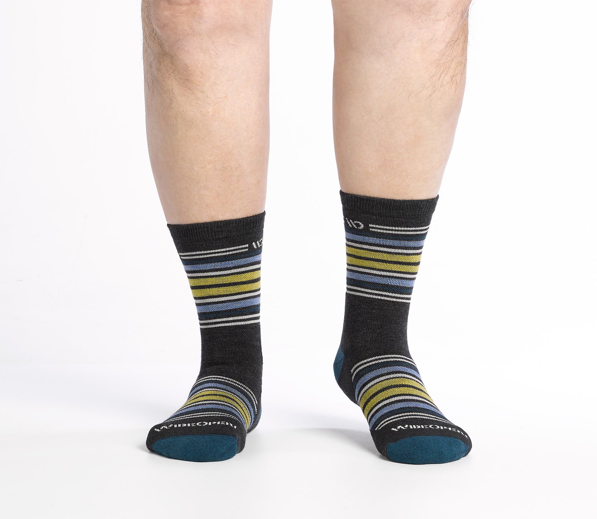 On model shot of Micro Crew socks with teal heel/toe and Cream logo, Charcoal body and blue and yellow  stripes.