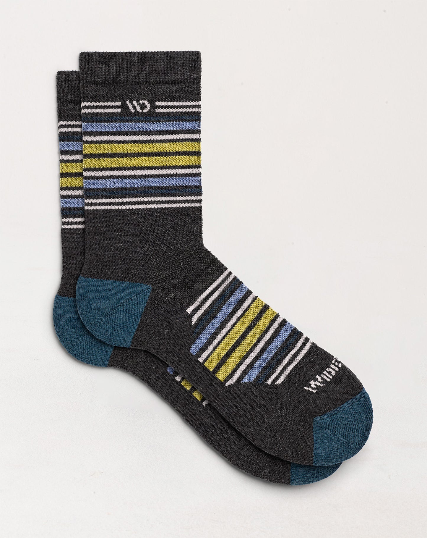 Socks laying flat with  stripes on the cuff and over the top of the foot with charcoal body and white logo--Charcoal