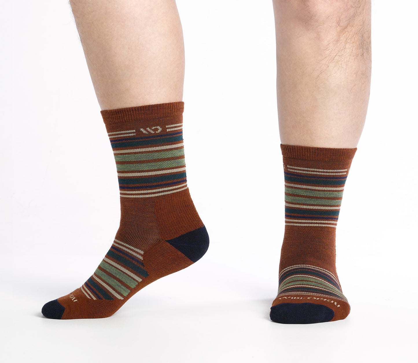 side view on body Micro Crew sock with dark heel/toe and Cream logo, Rust body and blue and green  stripes.