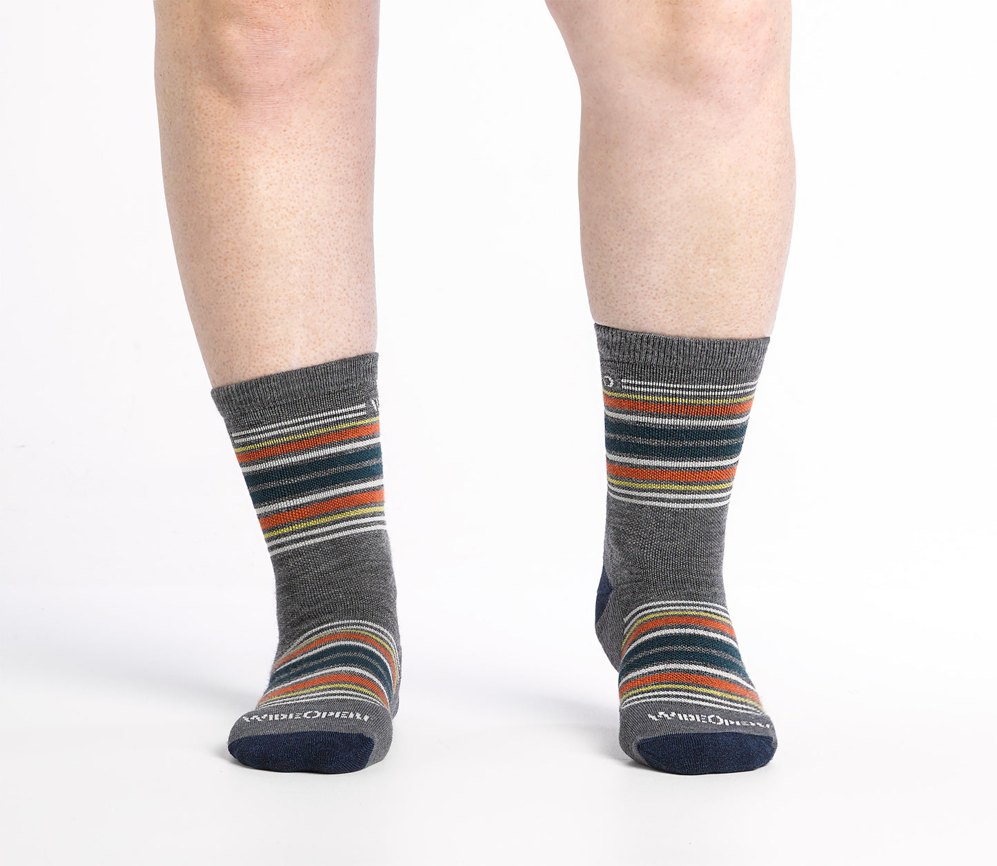 On body Micro Crew sock with navy heel/toe and Cream logo, Gray body and blue and orange stripes.