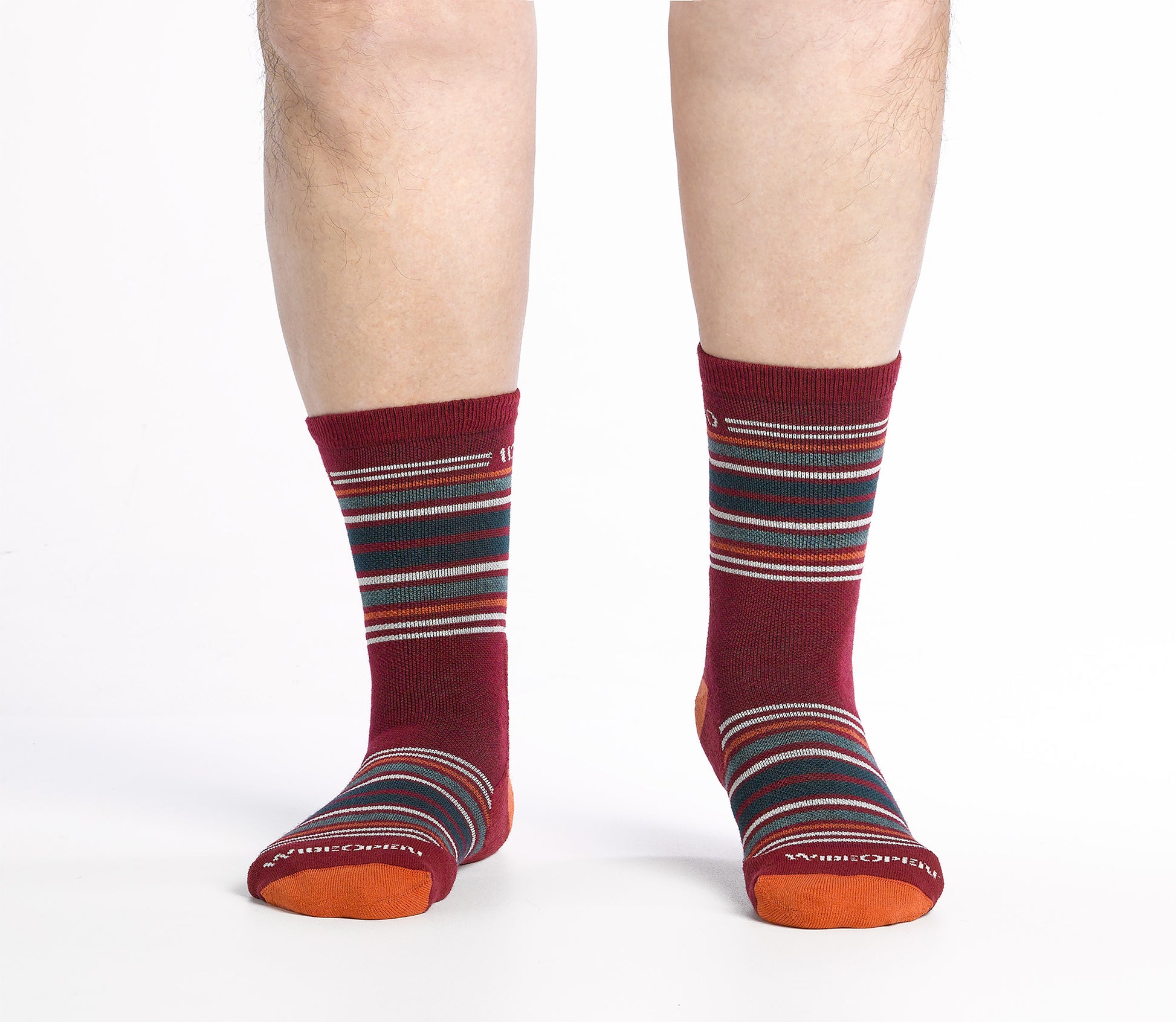 On body Micro Crew sock with orange heel/toe and Cream logo, red body and  green and orange  stripes.