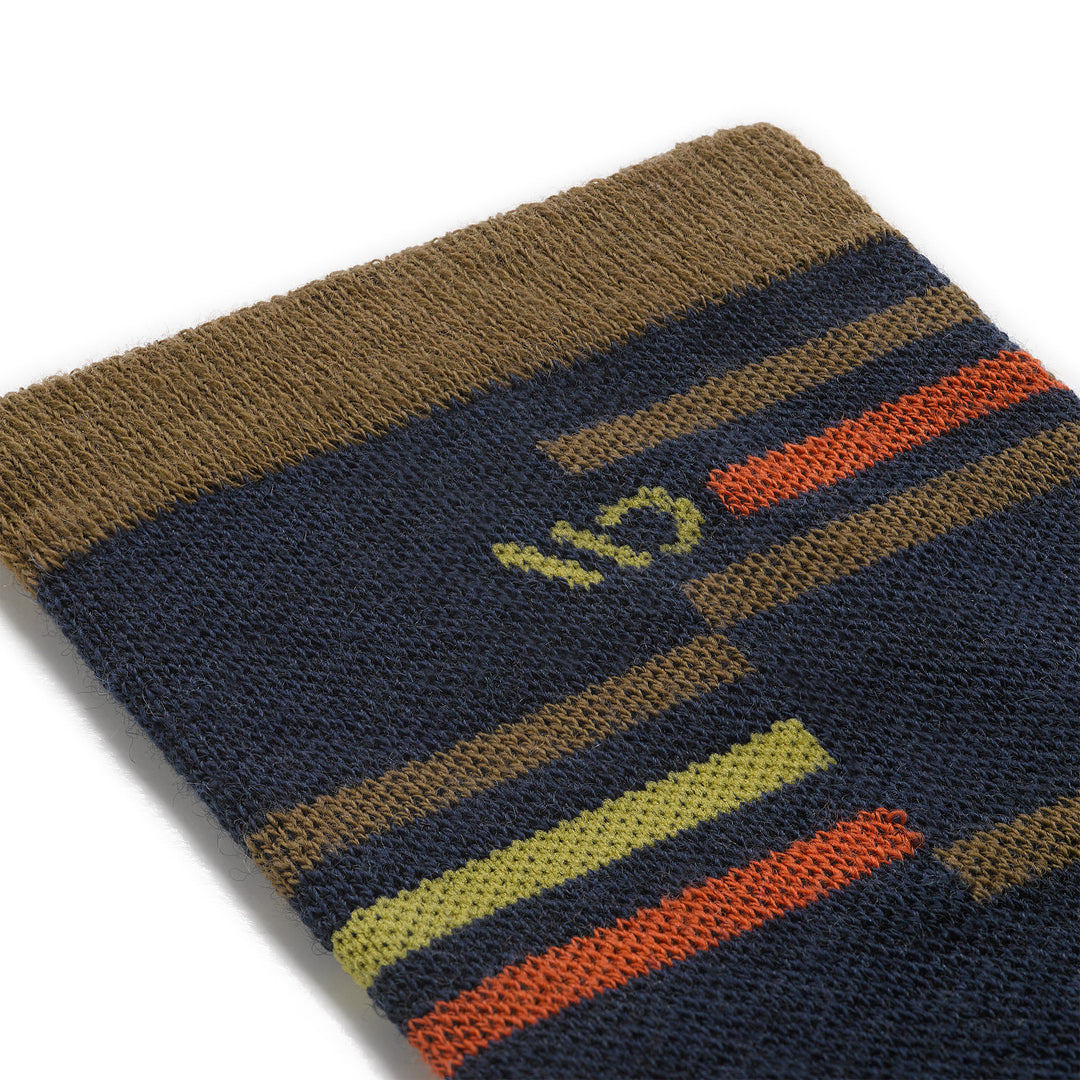 Detail image of the 9010 mens crossroad cushioned crew in navy close up of cuff with orange, brown, and yellow stripes