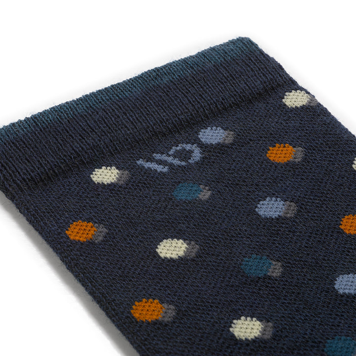 Detail image of mens on the dot cushioned crew 9011 in navy close up of cuff featuring cream, blue, orange dot on blue sock