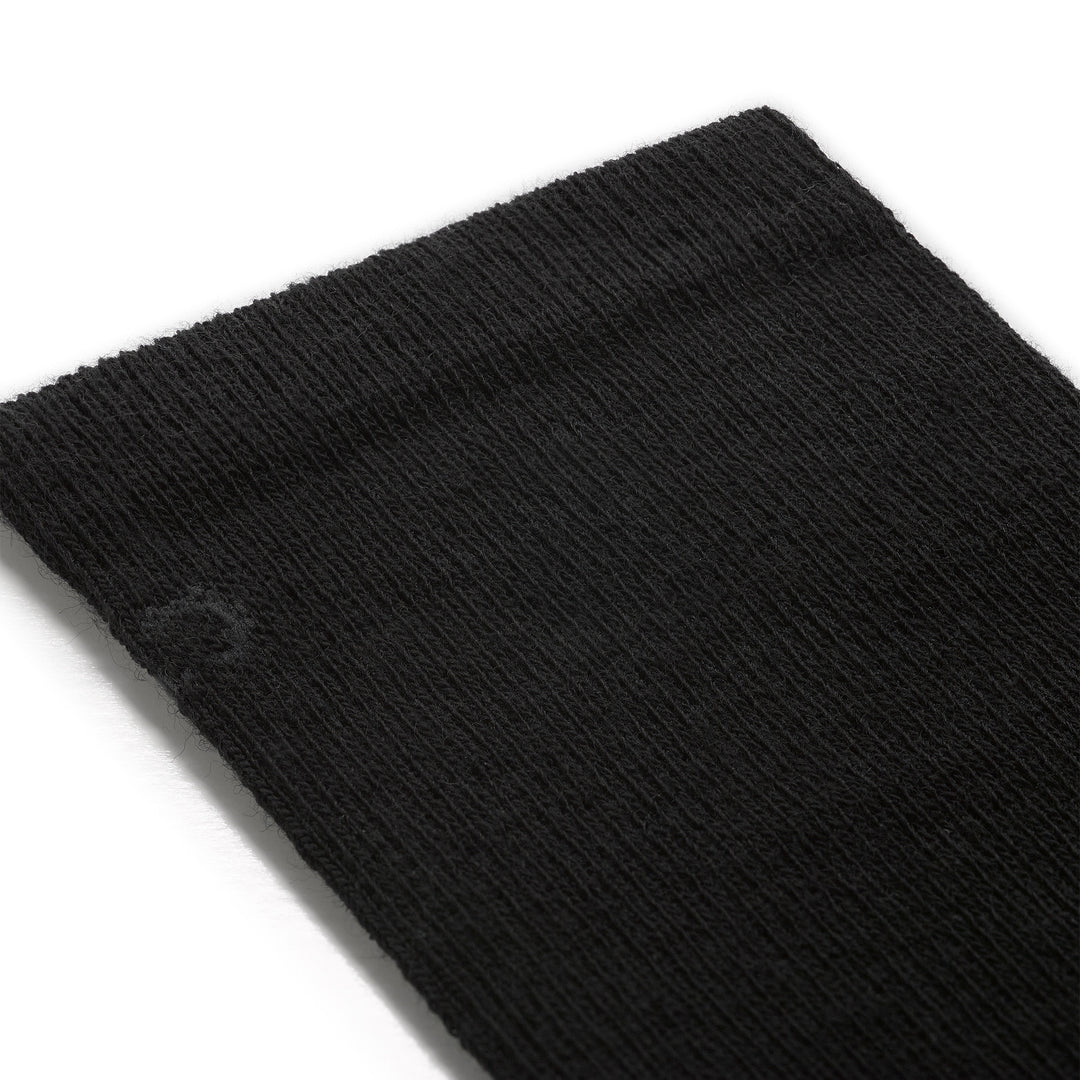 Detail image of mens solid lightweight crew 9012 in black close up of cuff featuring charcoal logo on black sock