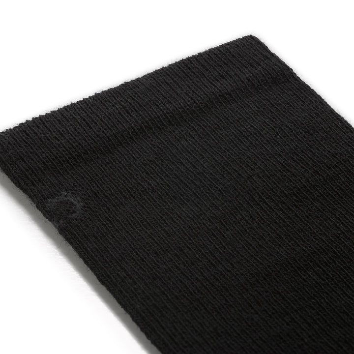 Detail image of mens solid lightweight crew 9012 in black close up of cuff featuring charcoal logo on black sock