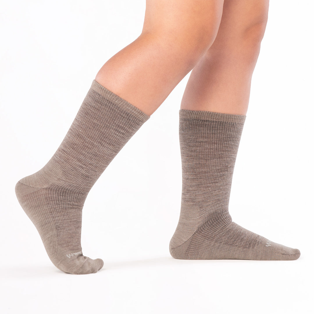 model walking to the right with back foot raised wearing the 9012 solid lightweight crew in rye