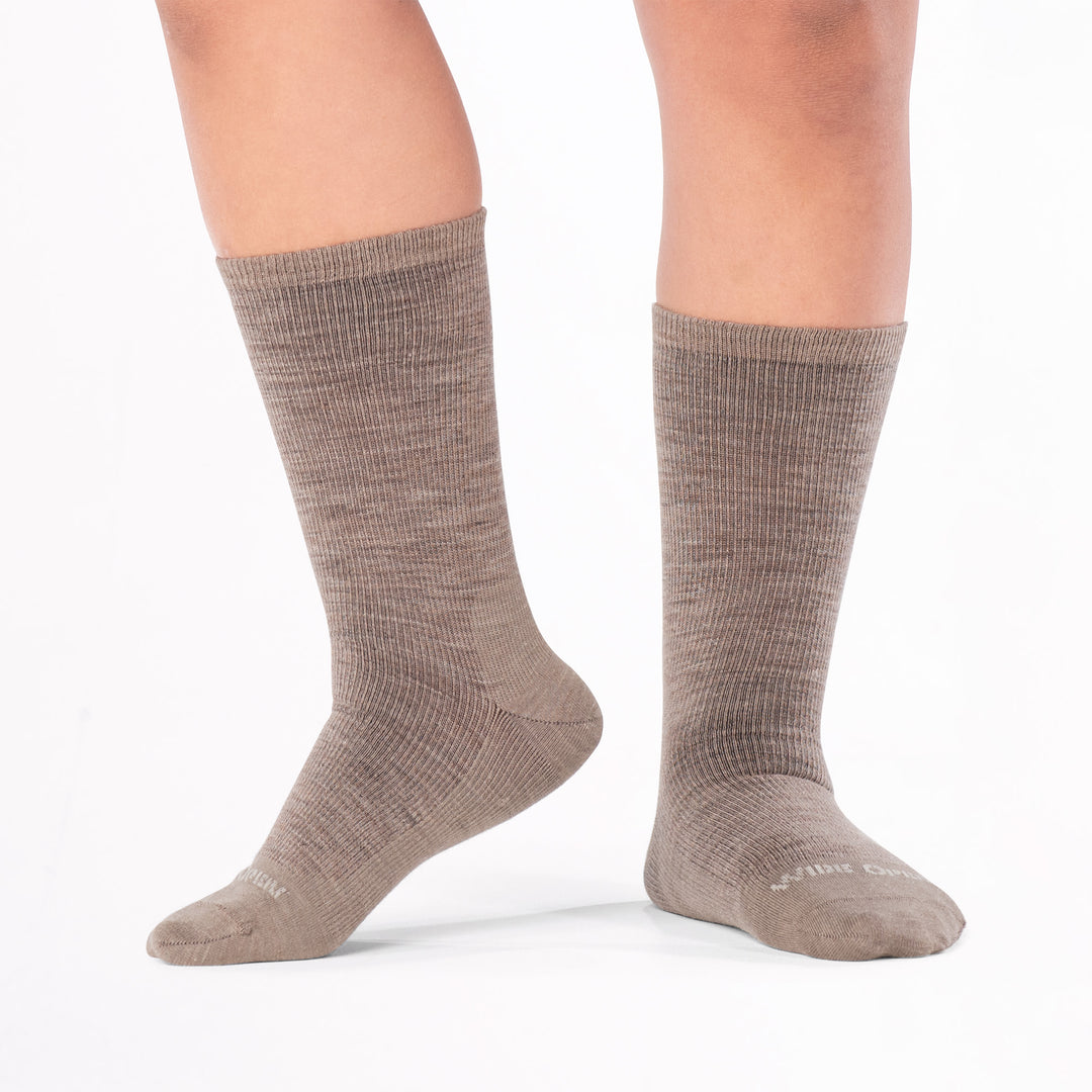 model standing with left foot raised wearing the 9012 solid lightweight crew in rye