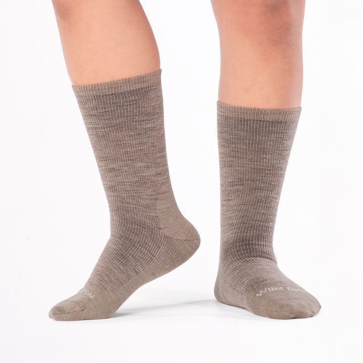 model standing with left foot raised wearing the 9012 solid lightweight crew in rye