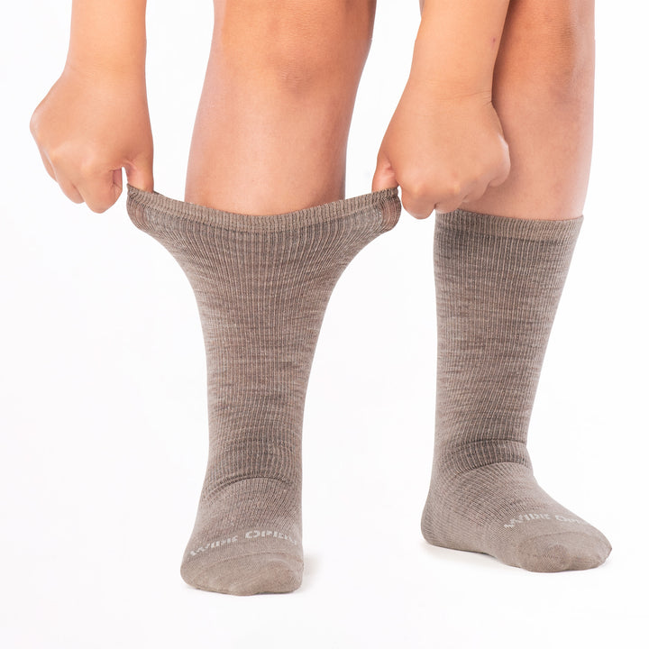 model stretching the cuff of the 9012 solid lightweight crew in rye