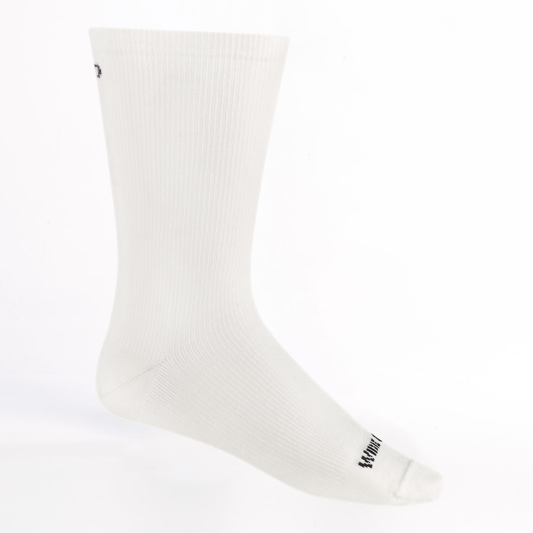 men's solid lightweight crew sock in white colorway featuring black logo and white body