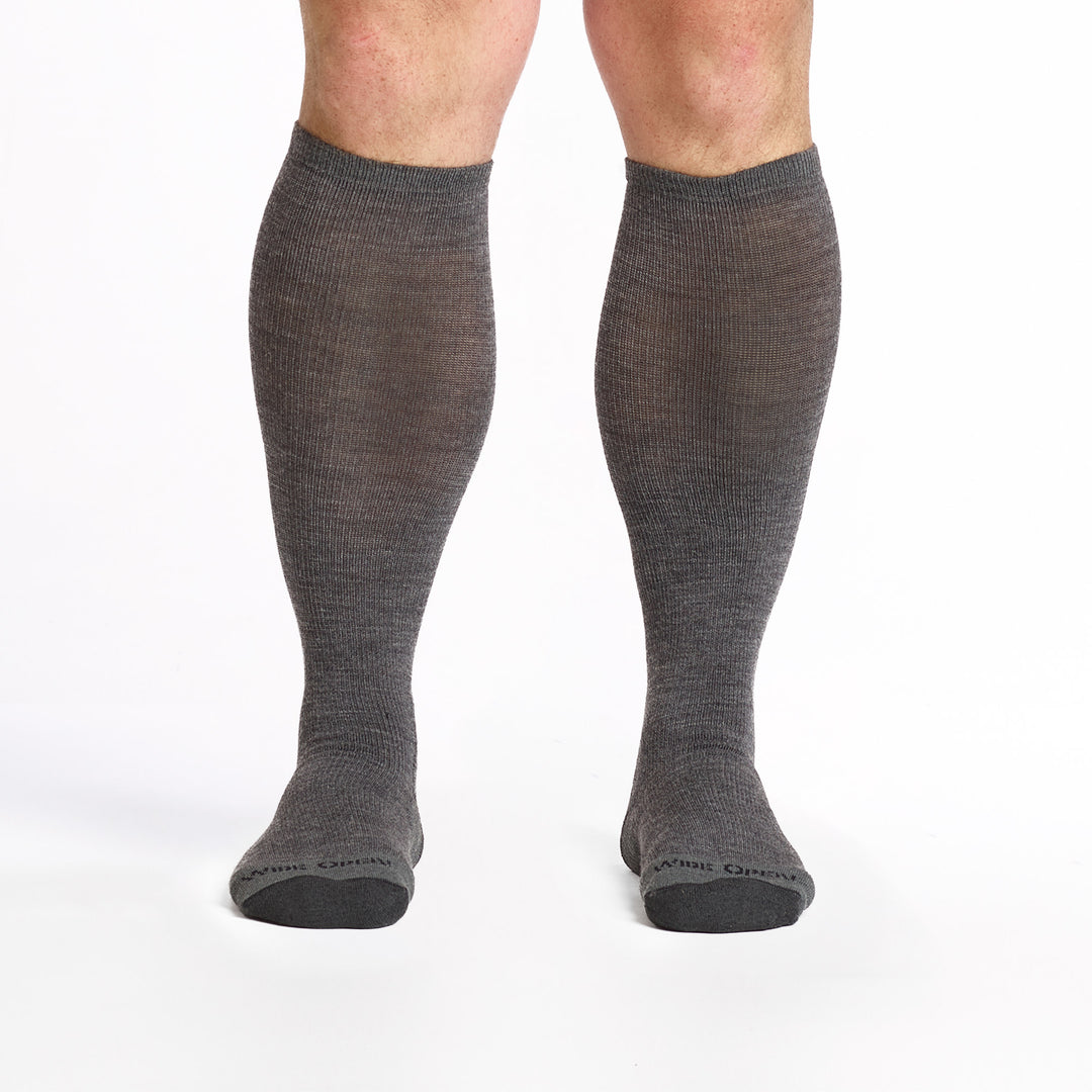 9017 gray knee high sock with charcoal heel/toe/logo shown from the front