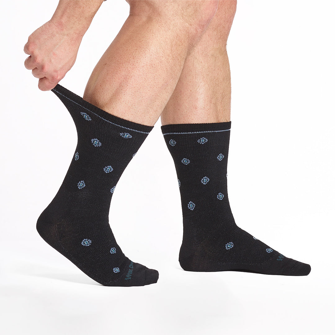 9518-Black crew sock with blue logo gray geometric dots and, shown from side with cuff stretched.