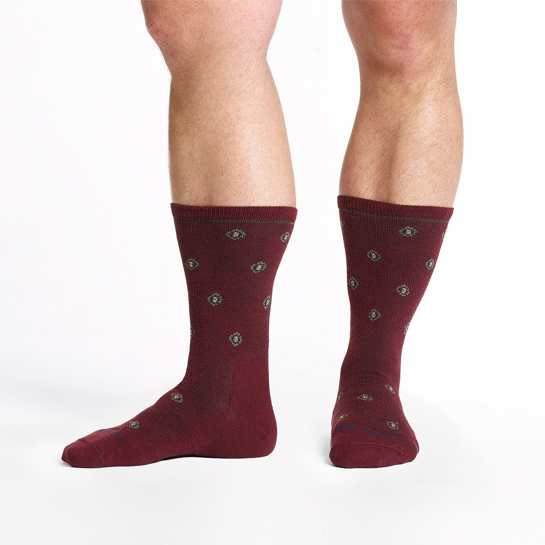 9018 burgundy crew sock with blue logo, taupe geometric dots shown from the front and side left foot pointed to side