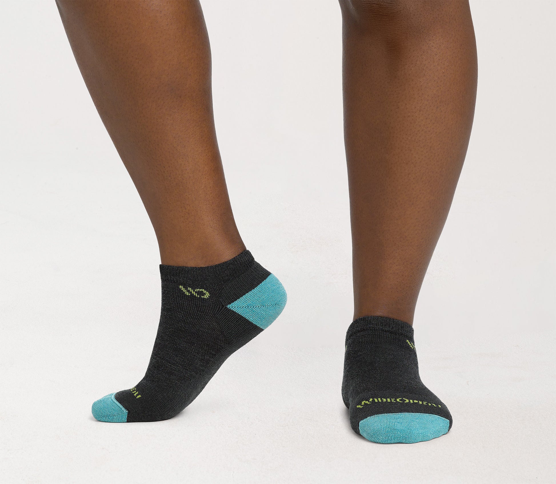 On model: No shows with aqua heel/toe and yellow logo, with charcoal body --Charcoal