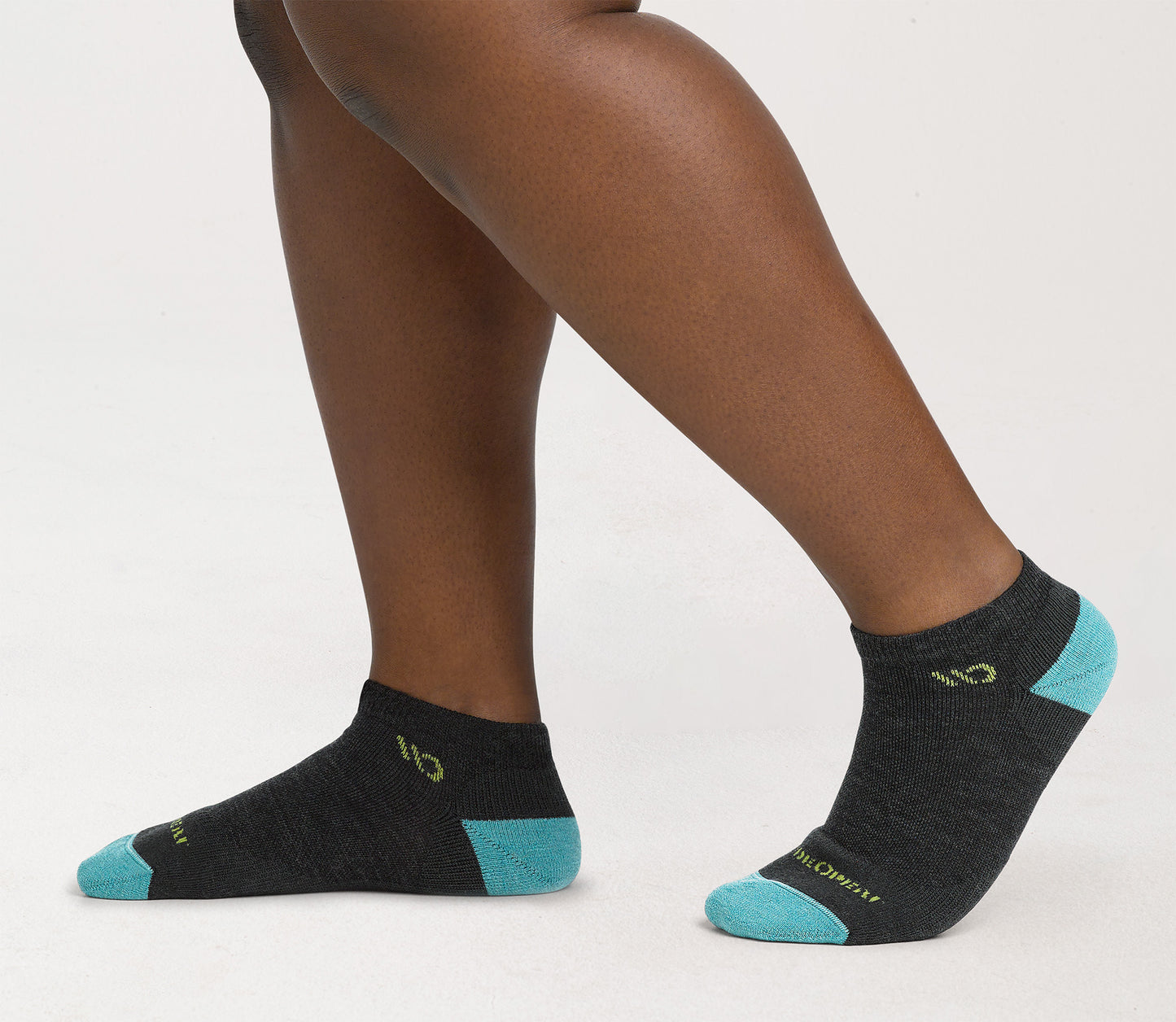 On model: No shows with aqua heel/toe and yellow logo, with charcoal body --Charcoal