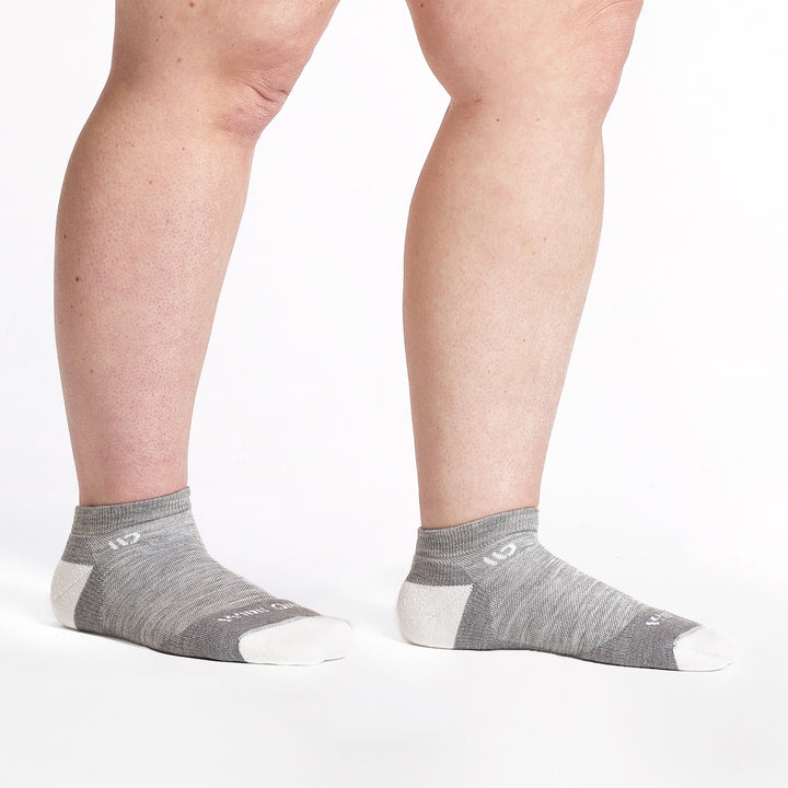 9500 lt gray ankle sock with white heel/toe/logo shown from the side 