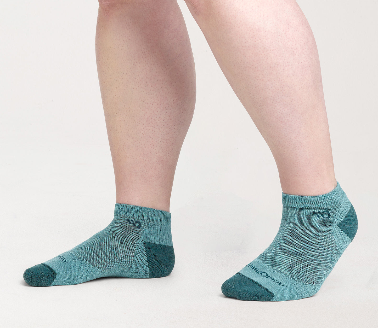 On model: No shows with dark teal heel/toe and logo, with light teal body --Light Teal